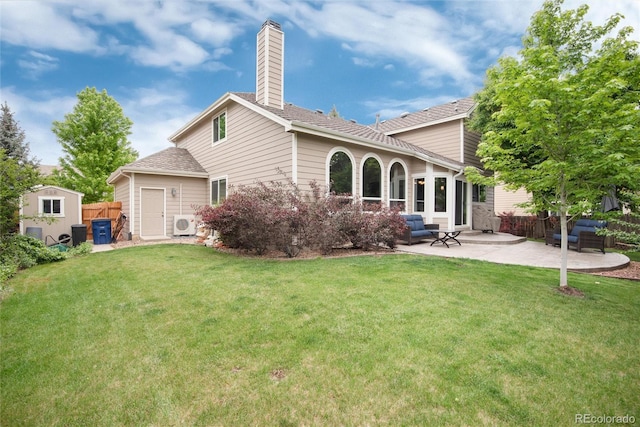 11056 W Rowland Ave, Littleton, CO 80127 - rear view of property with a patio, a chimney, and ac unit