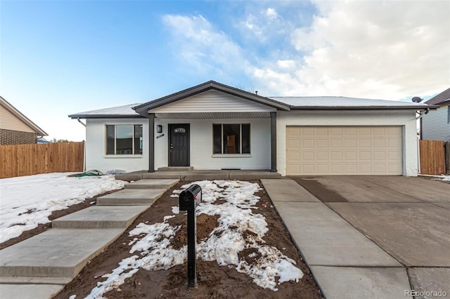 ranch-style house featuring a garage