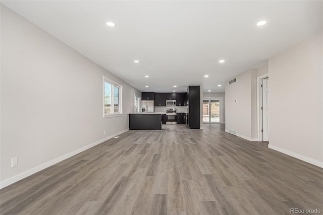 unfurnished living room featuring dark wood-type flooring