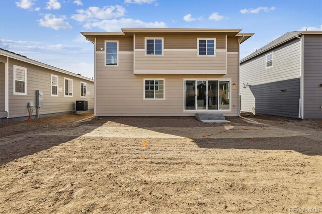 24769 E 39th Ave, Aurora, CO 80019 - rear view of house featuring entry steps and central AC