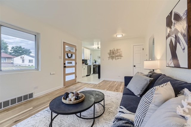 living room featuring light wood-type flooring