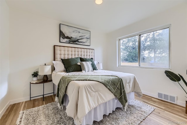 bedroom featuring light hardwood / wood-style floors