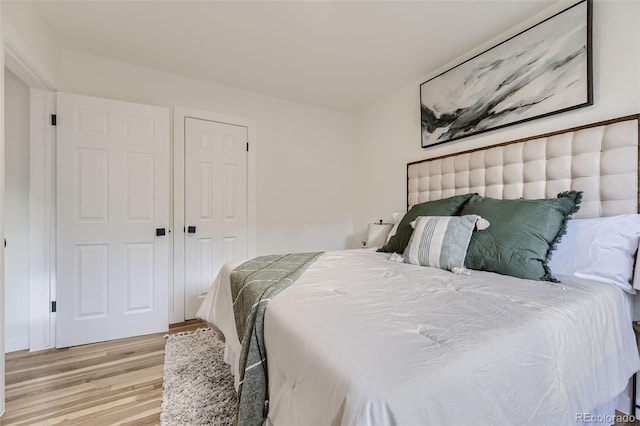 bedroom featuring light wood-type flooring