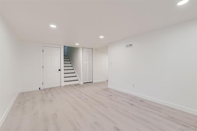 spare room featuring light hardwood / wood-style floors