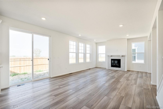 unfurnished living room featuring light hardwood / wood-style floors