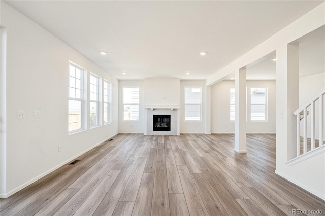 unfurnished living room with light wood-type flooring