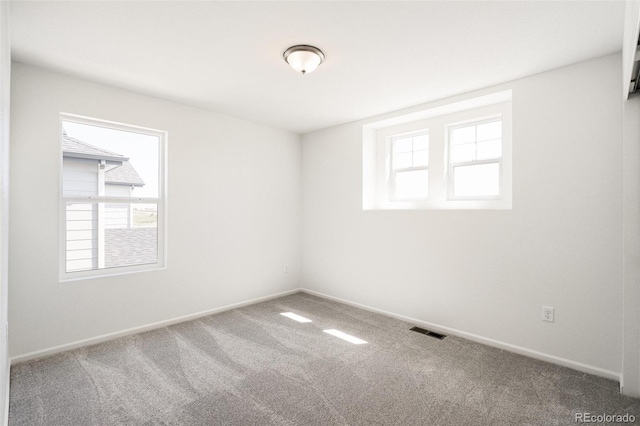 unfurnished room with carpet flooring