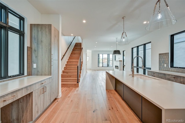 420 E Arkansas St, Buena Vista, CO 81211 - kitchen with a sink, modern cabinets, light wood-style flooring, light countertops, and recessed lighting