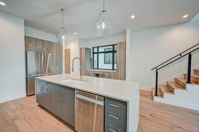 420 E Arkansas St, Buena Vista, CO 81211 - kitchen featuring appliances with stainless steel finishes, a sink, baseboards, light wood-style flooring, and recessed lighting