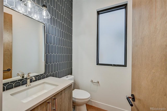 420 E Arkansas St, Buena Vista, CO 81211 - half bathroom featuring toilet, baseboards, and vanity