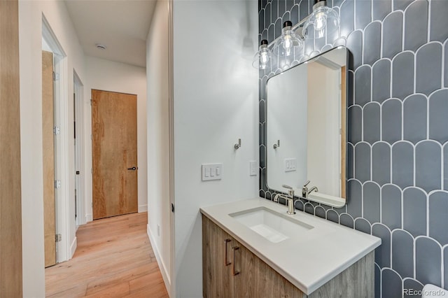 420 E Arkansas St, Buena Vista, CO 81211 - bathroom featuring wood finished floors, vanity, and baseboards