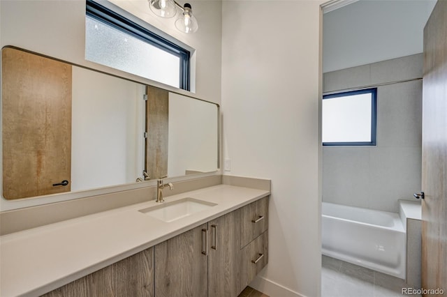 420 E Arkansas St, Buena Vista, CO 81211 - full bath featuring healthy amount of natural light, a bathtub, vanity, and tile patterned flooring
