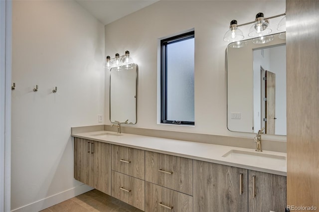 420 E Arkansas St, Buena Vista, CO 81211 - bathroom with double vanity, baseboards, and tile patterned floors