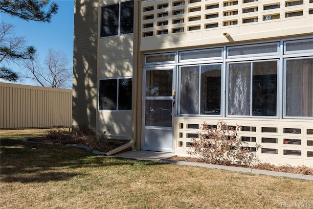 property entrance with a yard