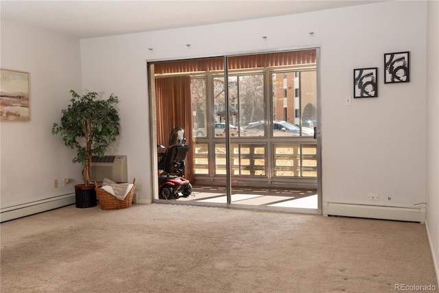 carpeted empty room featuring a baseboard heating unit, baseboard heating, and a wall mounted AC