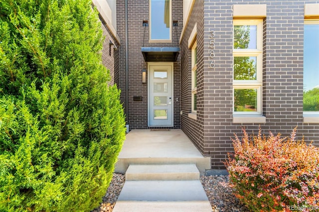 3586 S Ogden St, Englewood, CO 80113 - doorway to property with brick siding