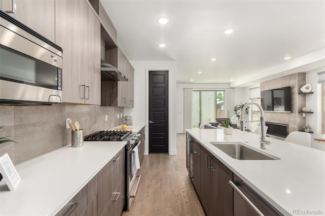 3586 S Ogden St, Englewood, CO 80113 - kitchen with appliances with stainless steel finishes, modern cabinets, and recessed lighting