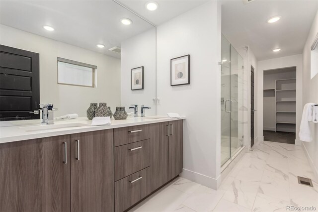 3586 S Ogden St, Englewood, CO 80113 - full bathroom with marble finish flooring, double vanity, a shower stall, and recessed lighting