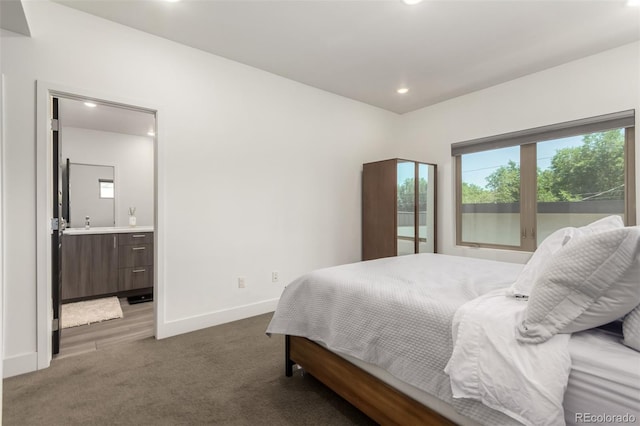 3586 S Ogden St, Englewood, CO 80113 - bedroom with dark colored carpet, recessed lighting, and ensuite bathroom