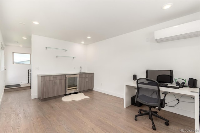 3586 S Ogden St, Englewood, CO 80113 - office area featuring a wall mounted AC, wine cooler, bar with sink, light wood-type flooring, and recessed lighting