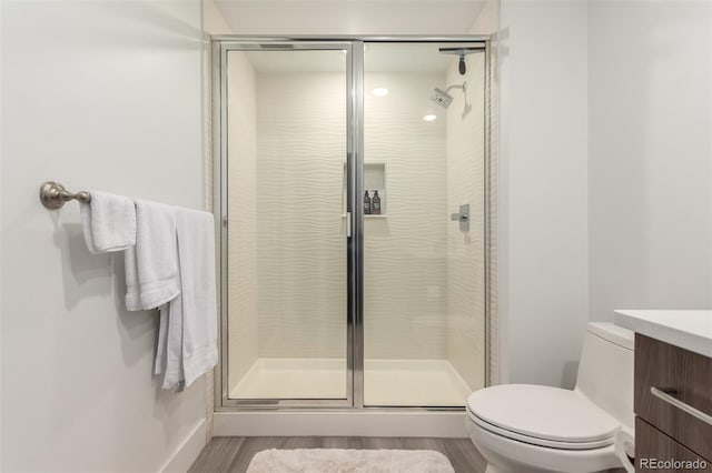 3586 S Ogden St, Englewood, CO 80113 - full bath featuring a stall shower, vanity, and wood finished floors