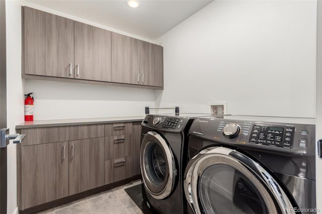 3586 S Ogden St, Englewood, CO 80113 - laundry area with washing machine and dryer and cabinet space