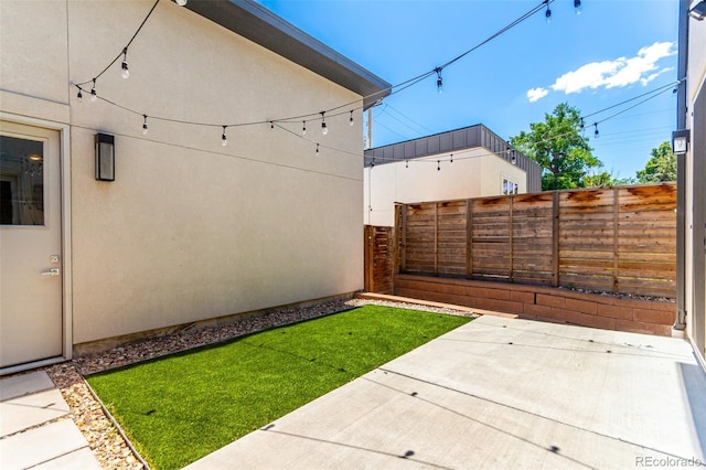 3586 S Ogden St, Englewood, CO 80113 - fenced backyard featuring a patio area