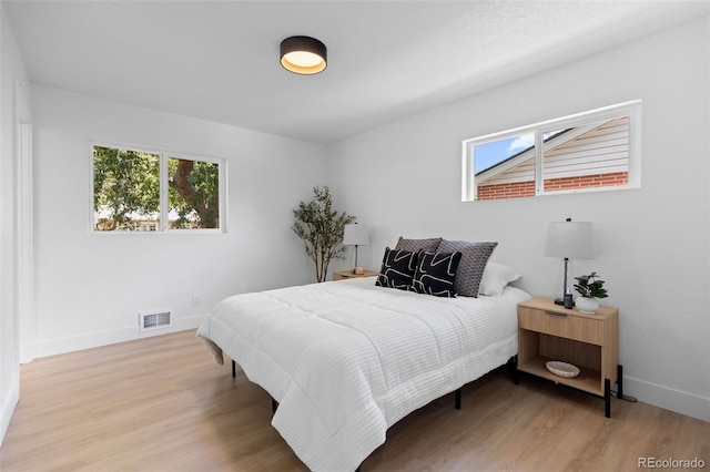 3036 Wolff St S, Denver, CO 80236 - bedroom with multiple windows and wood finished floors