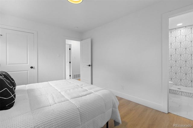 3036 Wolff St S, Denver, CO 80236 - bedroom featuring light wood-type flooring and baseboards