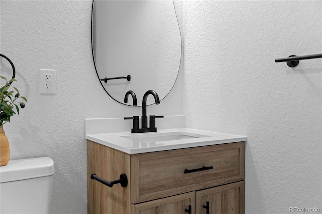 3036 Wolff St S, Denver, CO 80236 - bathroom featuring vanity and a textured wall
