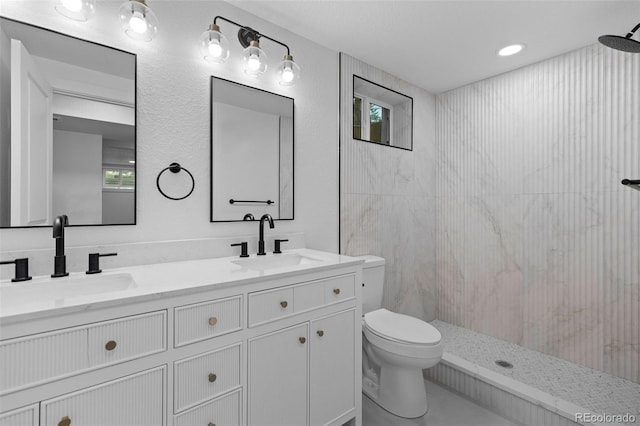 3036 Wolff St S, Denver, CO 80236 - bathroom featuring double vanity and a tile shower