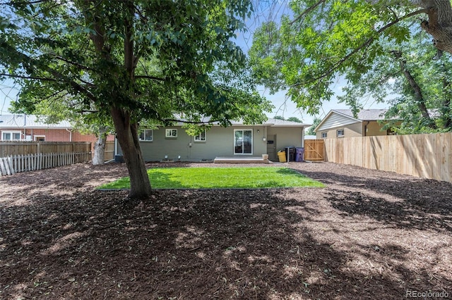3036 Wolff St S, Denver, CO 80236 - rear view of house with a fenced backyard