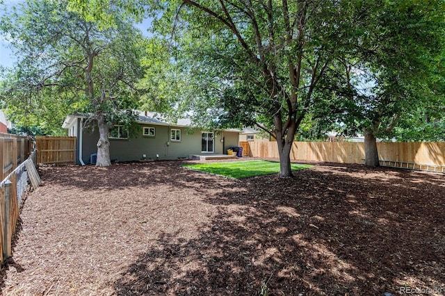 3036 Wolff St S, Denver, CO 80236 - fenced backyard with a patio