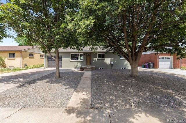 3036 Wolff St S, Denver, CO 80236 - ranch-style house featuring concrete driveway, brick siding, and an attached garage