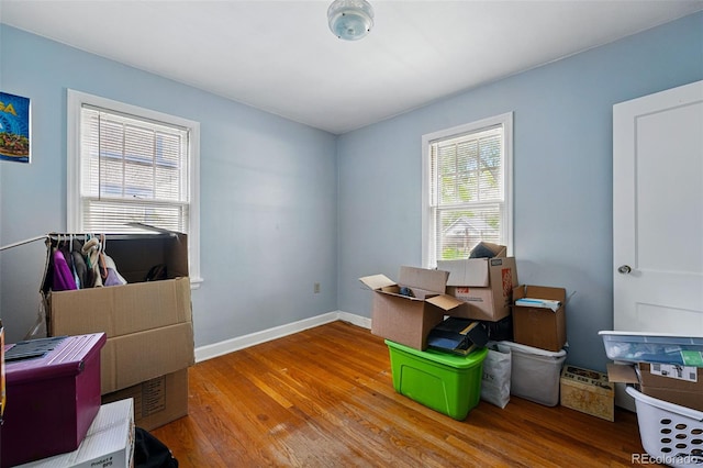 home office featuring wood finished floors and baseboards