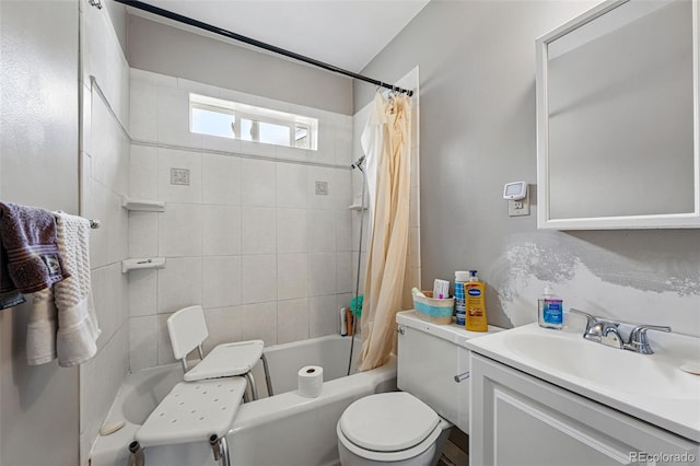 bathroom with shower / bath combo, vanity, and toilet