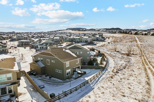 snowy aerial view featuring a residential view