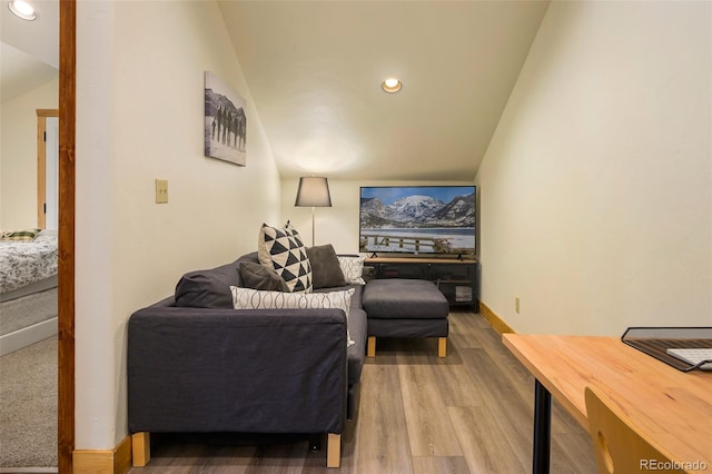 living room with recessed lighting, lofted ceiling, baseboards, and wood finished floors