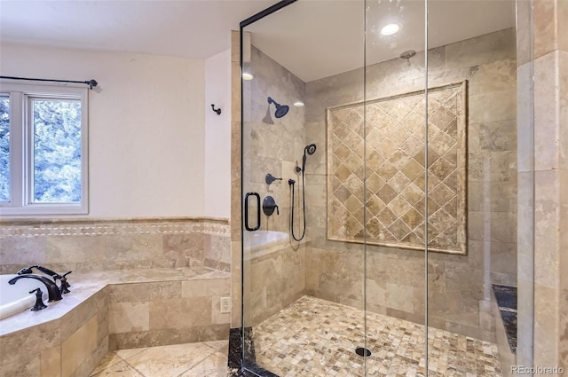 bathroom featuring plus walk in shower