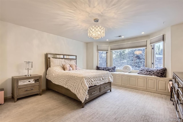 carpeted bedroom with a notable chandelier