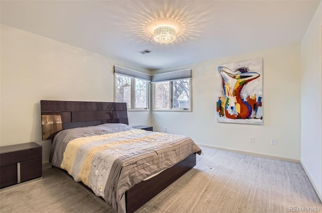 bedroom featuring light colored carpet