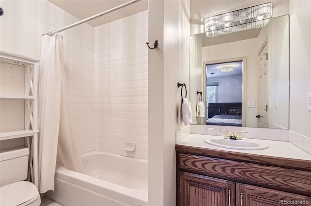 full bathroom with shower / tub combo with curtain, vanity, and toilet