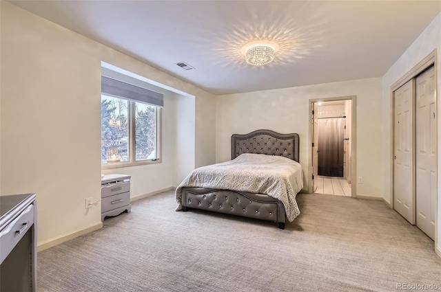 bedroom with light colored carpet and a closet