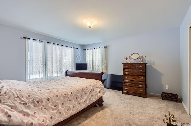 bedroom featuring light colored carpet