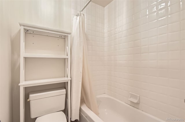 bathroom featuring shower / bath combination with curtain and toilet