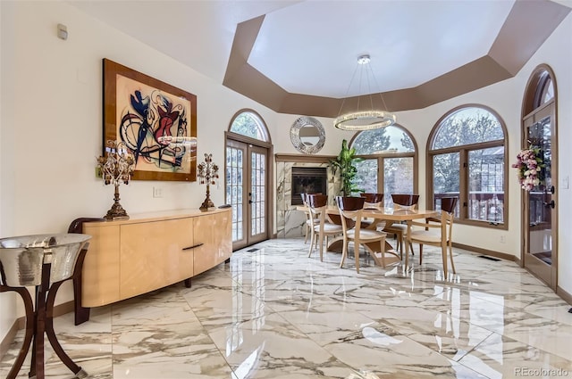 4681 S Columbine Ct, Cherry Hills Village, CO 80113 - dining space with french doors, healthy amount of natural light, and light marble finish floors