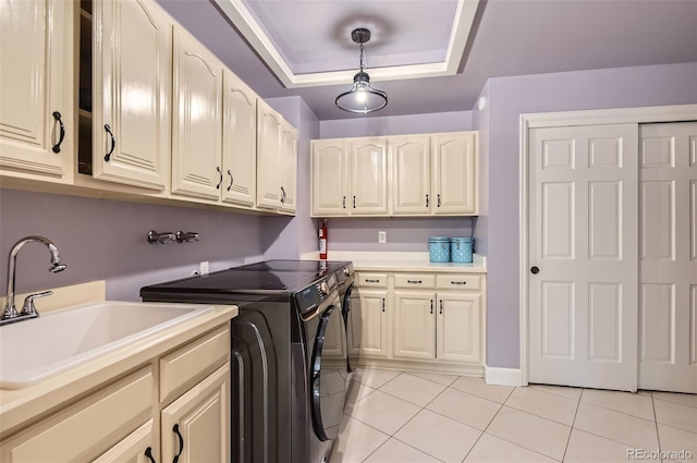 4681 S Columbine Ct, Cherry Hills Village, CO 80113 - laundry area featuring light tile patterned floors, cabinet space, and washer and dryer