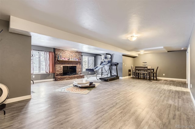 4681 S Columbine Ct, Cherry Hills Village, CO 80113 - exercise area featuring a fireplace and wood finished floors