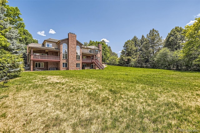 4681 S Columbine Ct, Cherry Hills Village, CO 80113 - back of property with brick siding, a chimney, and a yard