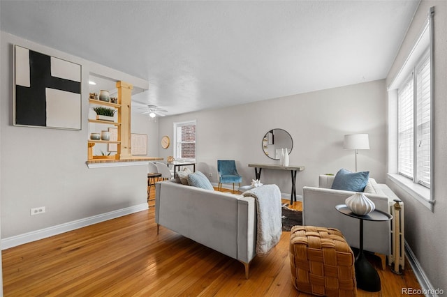 2867 Jasmine St, Denver, CO 80207 - living area with wood finished floors, healthy amount of natural light, and a ceiling fan